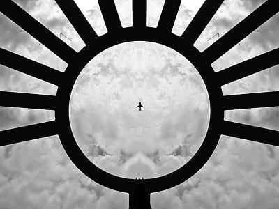 airplane through round metal frame thumbnail