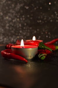 red chili beside lighted votive candle thumbnail