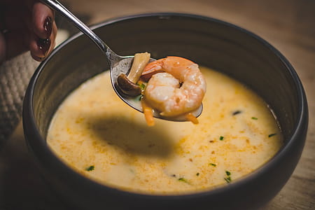 Bowl of Shrimp Soup on Brown Wooden Surface thumbnail