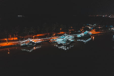 aerial view of boats in dock durig night thumbnail