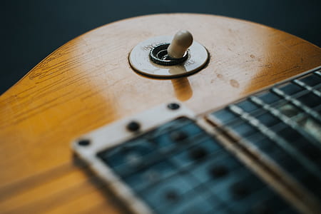 close up photography of brown and black guitar thumbnail