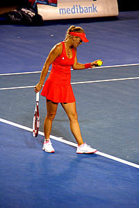 female tennis player performing serve thumbnail
