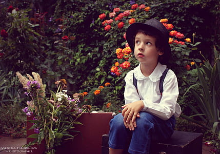 girl wearing white bertha-collar long-sleeved shirt sitting on garden thumbnail