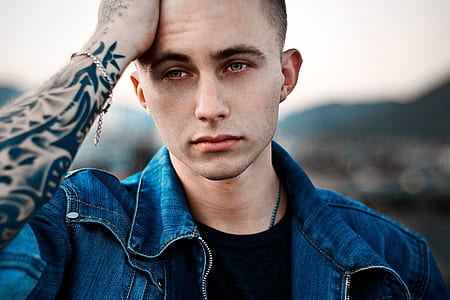 man wearing blue denim zip-up collared top thumbnail