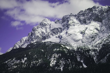 snow covered mountain under blue sky thumbnail