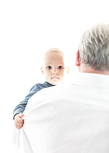 man carrying boy while taking selfie thumbnail