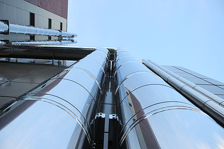 bottom view on curtain wall building under blue sky thumbnail