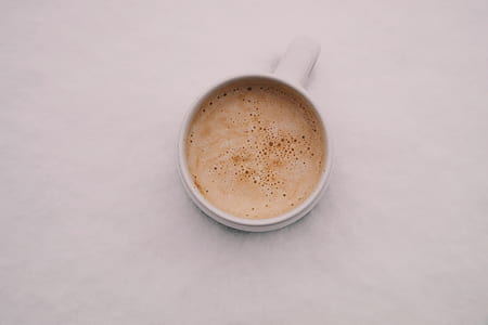 white ceramic mug filled with coffee thumbnail