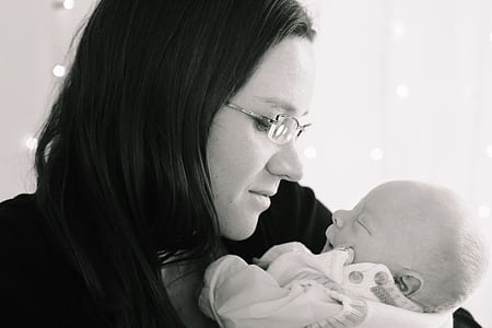 woman carrying baby thumbnail