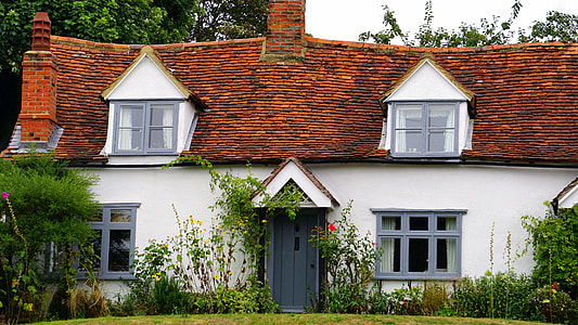 white and brown house near green leaf tree thumbnail