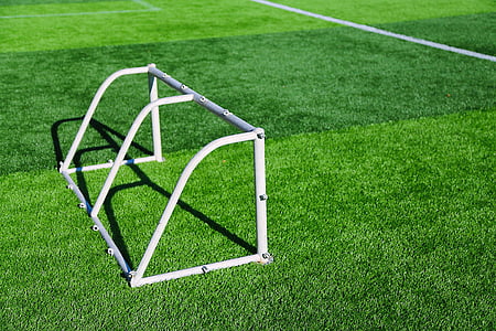 white metal goal on green grass thumbnail