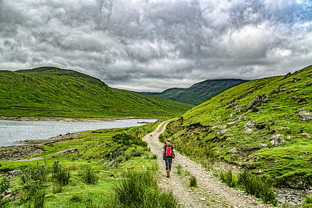 person walking towards mountain thumbnail