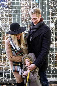 Family Laughing With Holiday Lights Photo thumbnail
