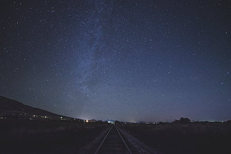 train rail photo during nighttime thumbnail