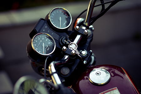 selective-focus photography of maroon motorcycle thumbnail