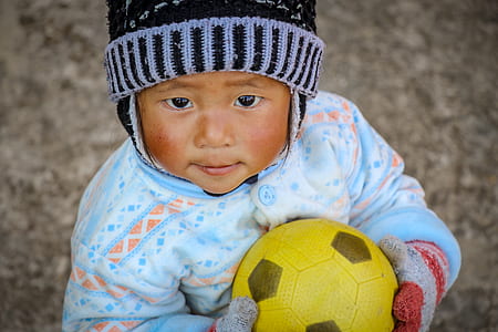 toddler wearing black and gray knit hat thumbnail