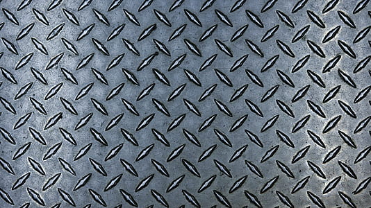 close up photo of diamond plated gray metal surface thumbnail