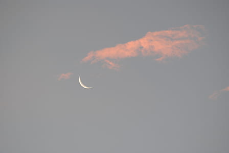 moon covered by clouds at daytime thumbnail