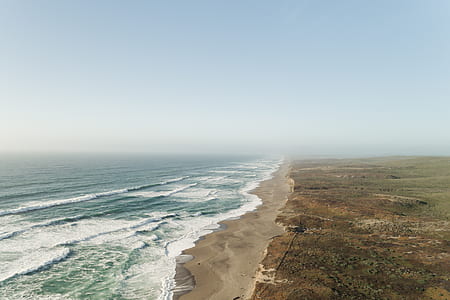 bird's eye photography of seashore body of water thumbnail