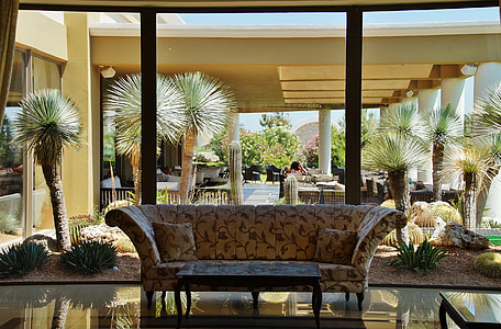 brown suede couch near clear glass window thumbnail