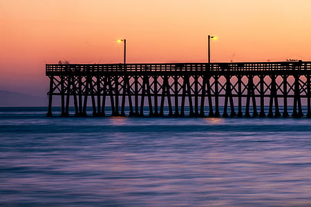 photography of bridge port at body of water thumbnail