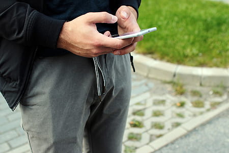 Guy checks the smartphone on street thumbnail