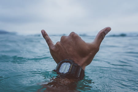 person underwater showing doing hand sign language thumbnail