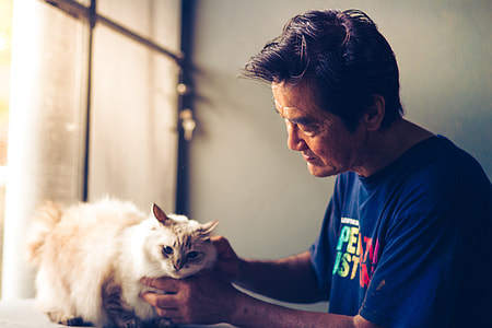 man holding cat thumbnail
