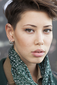 woman wearing green and white scarf thumbnail
