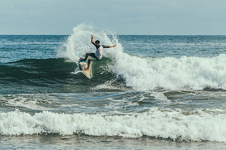 person surfing in a body of water thumbnail