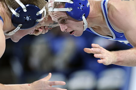 two men facing each other about to wrestle thumbnail