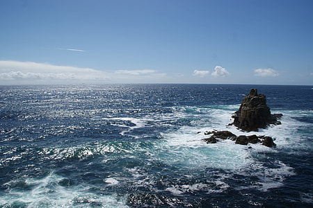 body of water under blue sky photography thumbnail