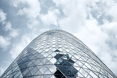 worm's-eye view photography of glass panel building thumbnail
