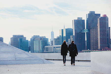 man and woman walking on building thumbnail