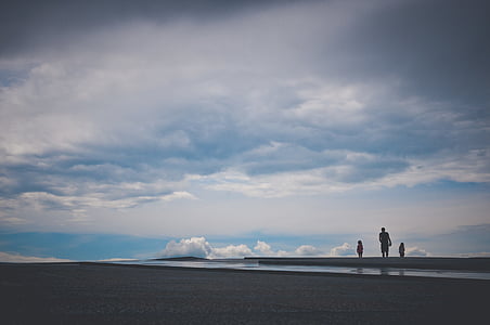 man standing beside body of water thumbnail