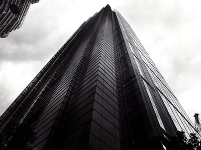 bottom view photography of grayscale building thumbnail