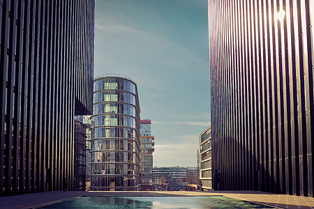 in-ground pool near curtain wall buildings thumbnail