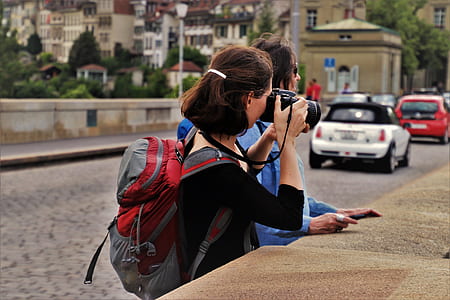 woman using DSLR camera thumbnail