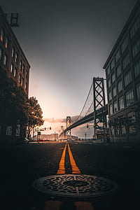 bridge near building during daytime thumbnail