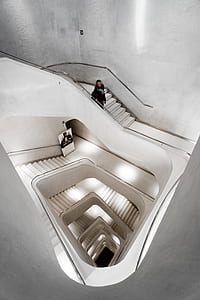 person wearing black hoodie standing on stair thumbnail