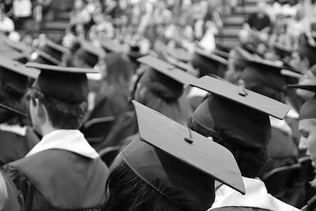 grayscale photo of student wearing academic gowns thumbnail