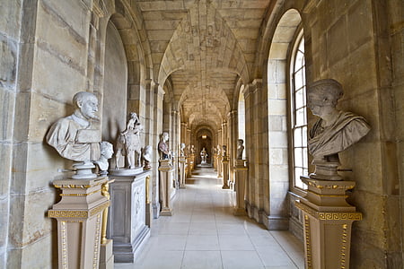 hallway surrounded with head busts thumbnail