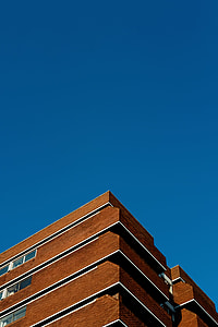 brown painted building during daytime thumbnail