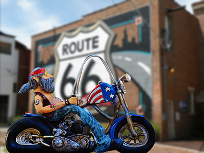 man riding cruiser motorcycle figurine thumbnail
