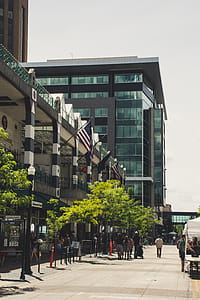 Black and White Concrete Building With Usa Flag thumbnail