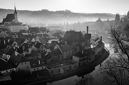 grayscale photo of town during dusk thumbnail
