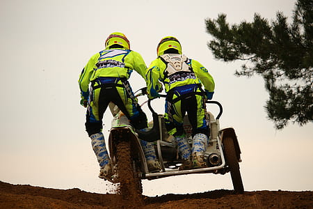 two men riding on motorcycle with cab thumbnail