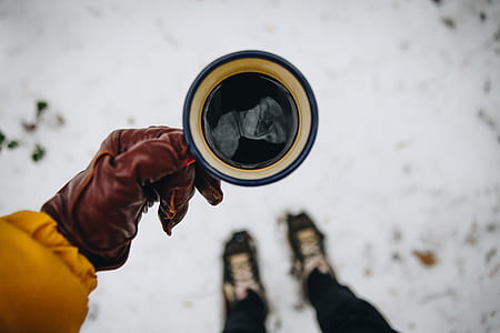 person holding ceramic mug thumbnail