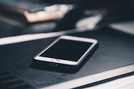 silver iPhone 6 on black table thumbnail