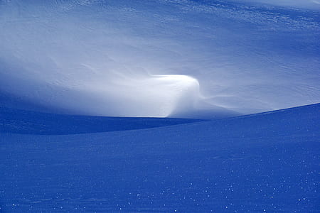 landscape photography of mountains under white clouds thumbnail